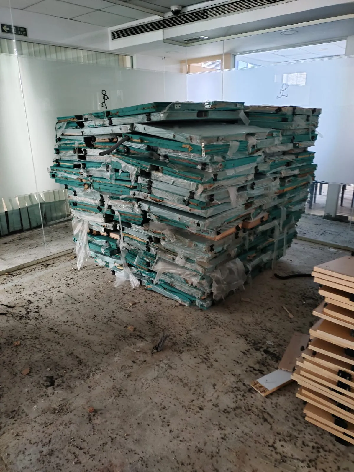 Pile of sorted aluminum and iron frame elements collected during office dismantling services in Bellandur